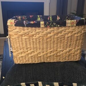 Spense Woven Basket with black decorative lining and sturdy covered handles.